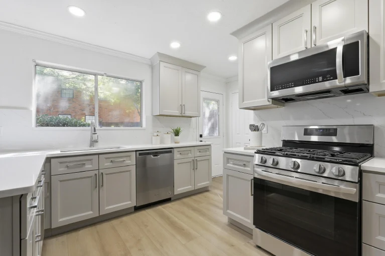 Bedford TX kitchen remodel — sink, dishwasher, range view