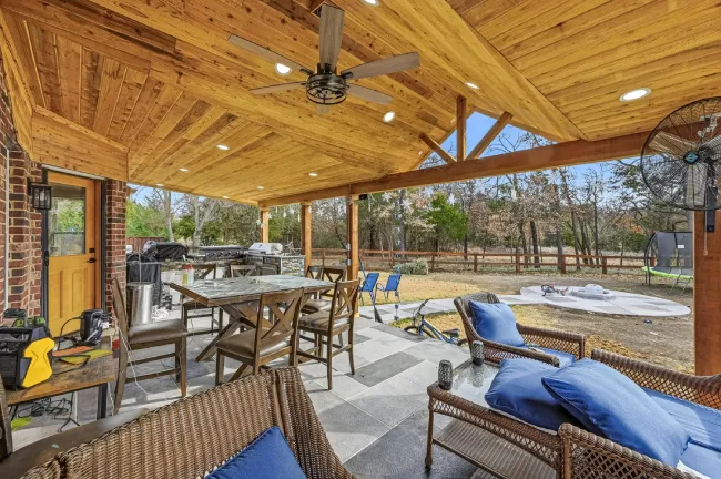 Lake Dallas TX covered patio remodel with wood ceiling and seating area